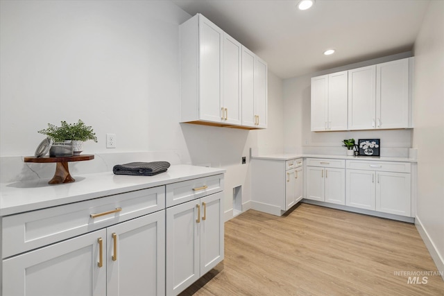 1678 Majestic View Dr, Mccall, ID 83638 - kitchen with recessed lighting, light countertops, white cabinets, and light wood-type flooring