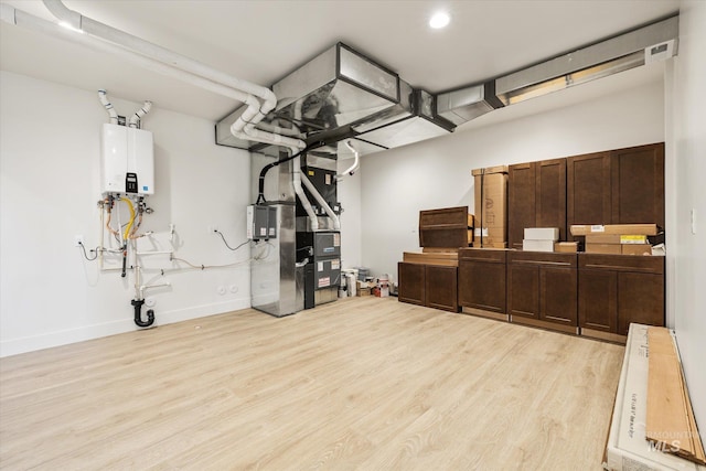 1678 Majestic View Dr, Mccall, ID 83638 - exercise area with tankless water heater, wood finished floors, and recessed lighting