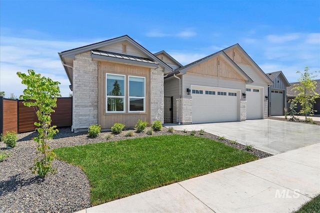 6874 N Fireball, Meridian, ID 83646 - view of front of house with stone siding, an attached garage, concrete driveway, and a standing seam roof