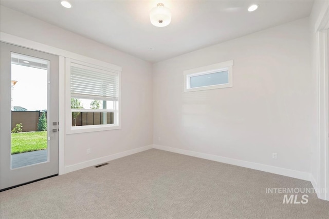 6874 N Fireball, Meridian, ID 83646 - carpeted empty room with baseboards and recessed lighting