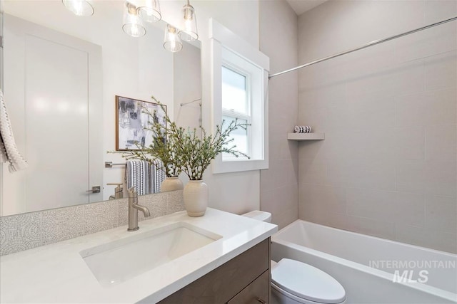 6874 N Fireball, Meridian, ID 83646 - bathroom with vanity, toilet, and bathtub / shower combination