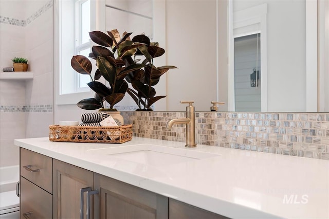 6874 N Fireball, Meridian, ID 83646 - bathroom with toilet, tasteful backsplash, and vanity