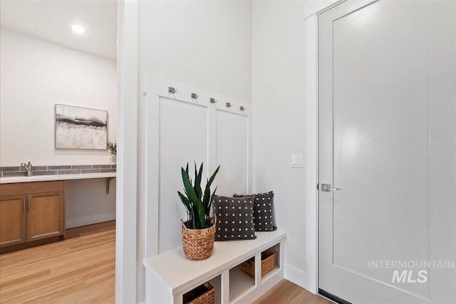 6874 N Fireball, Meridian, ID 83646 - mudroom with light wood-style flooring, a sink, and recessed lighting