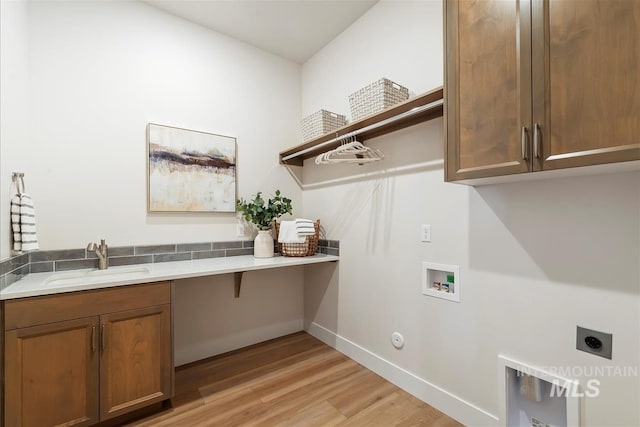6874 N Fireball, Meridian, ID 83646 - laundry area featuring electric dryer hookup, cabinet space, light wood-style flooring, hookup for a washing machine, and baseboards
