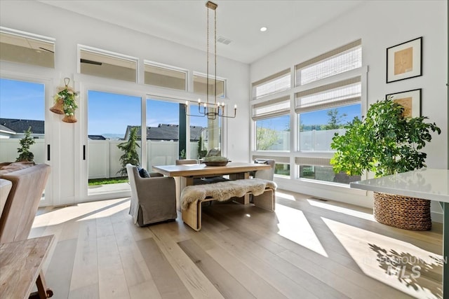sunroom with a chandelier