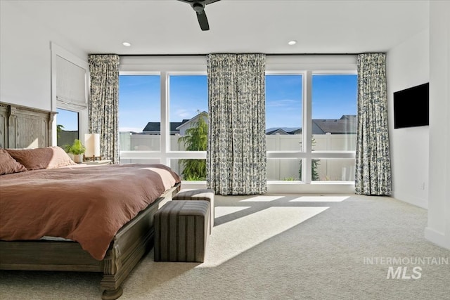 bedroom with carpet, a ceiling fan, and baseboards