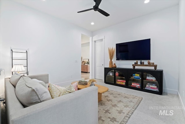 carpeted living area with ceiling fan, recessed lighting, and baseboards