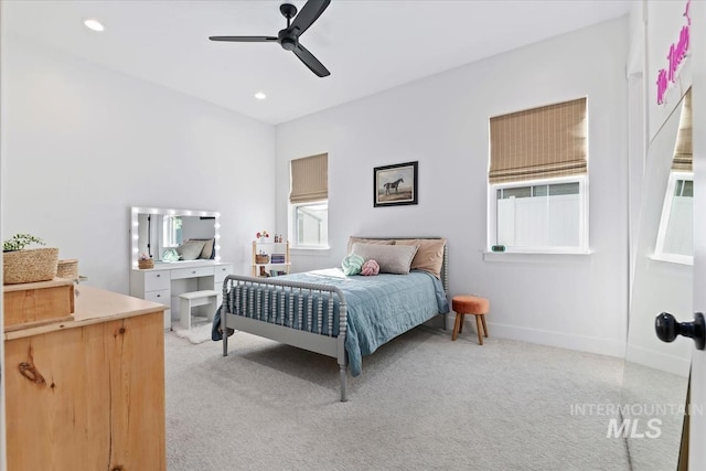 bedroom featuring light carpet, recessed lighting, baseboards, and a ceiling fan