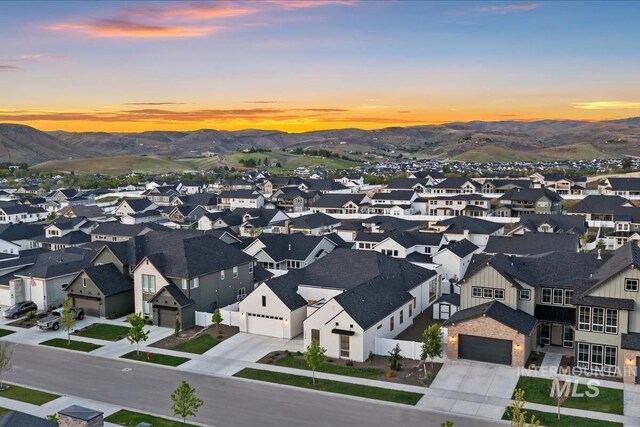 aerial view at dusk of a mountain view and a residential view