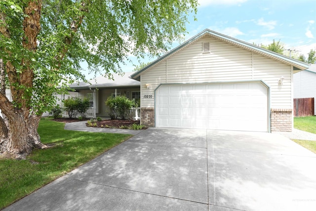 13270 W Satinleaf, Boise, ID 83713 - ranch-style house with driveway, brick siding, an attached garage, and a front lawn