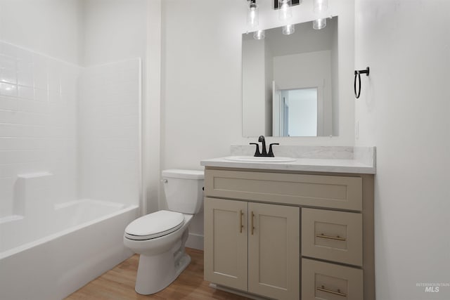 2950 Mcbride Pl, Burley, ID 83318 - full bathroom featuring vanity, hardwood / wood-style floors,  shower combination, and toilet