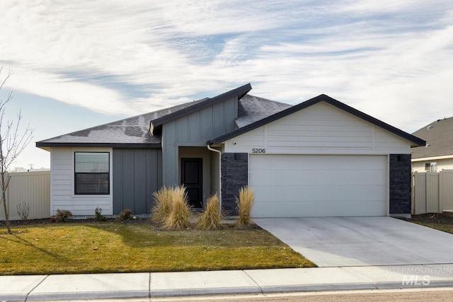 ranch-style house with a garage and a front lawn