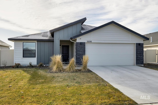 single story home with a front yard and a garage