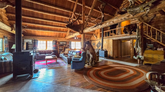 2742 Dixie Rd, Dixie, ID 83525 - living room featuring lofted ceiling with beams, wood-type flooring, rustic walls, and wooden ceiling
