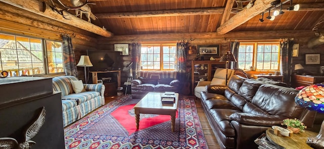 2742 Dixie Rd, Dixie, ID 83525 - living room featuring vaulted ceiling with beams, plenty of natural light, and wooden ceiling