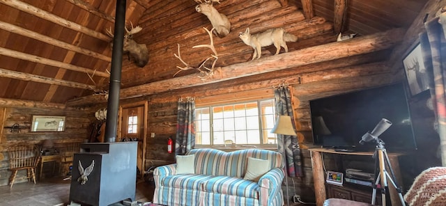 2742 Dixie Rd, Dixie, ID 83525 - living room with rustic walls, wood ceiling, high vaulted ceiling, a wood stove, and beam ceiling