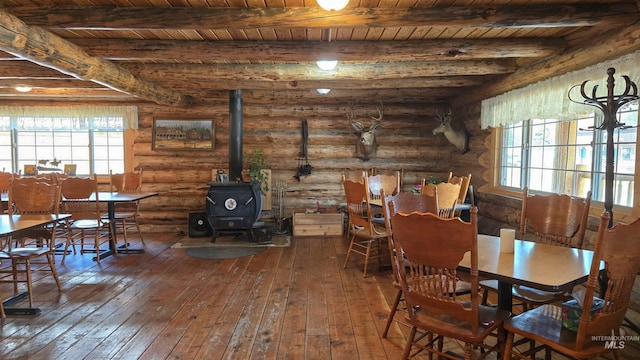2742 Dixie Rd, Dixie, ID 83525 - dining room with hardwood / wood-style flooring, a wood stove, and wood ceiling
