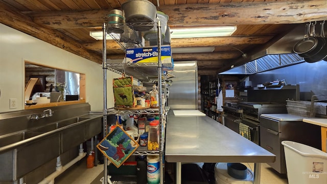 2742 Dixie Rd, Dixie, ID 83525 - kitchen featuring beamed ceiling, stainless steel refrigerator, rustic walls, and wood ceiling