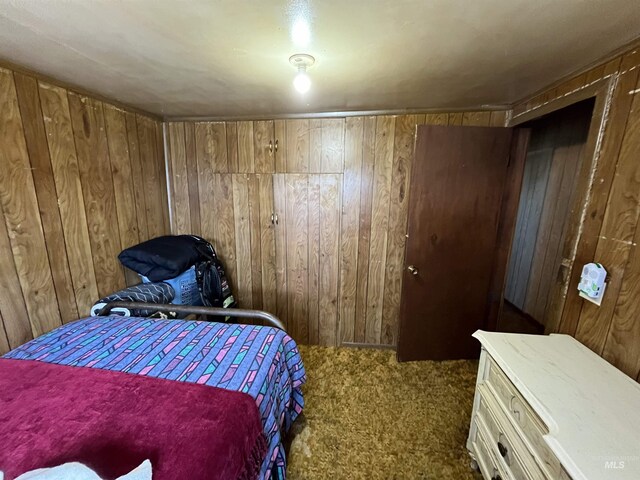 2131 N 2900 W, Arco, ID 83213 - bedroom with carpet flooring and wooden walls