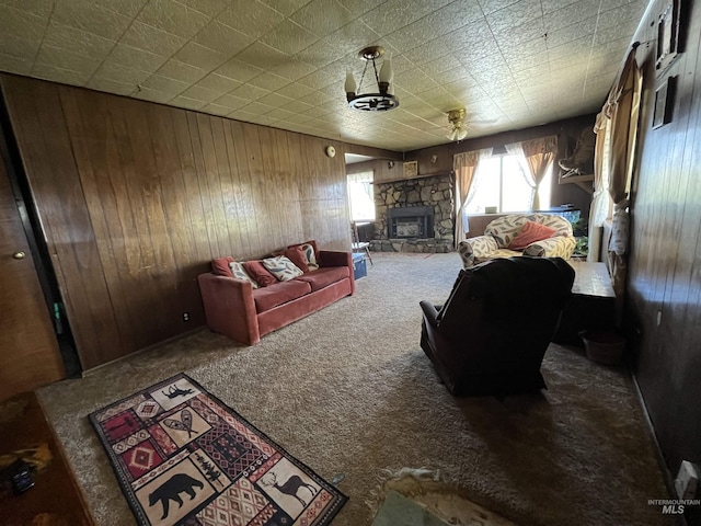 2131 N 2900 W, Arco, ID 83213 - living area with wooden walls, carpet, and a stone fireplace