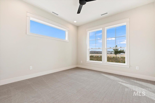 unfurnished room with ceiling fan and carpet floors