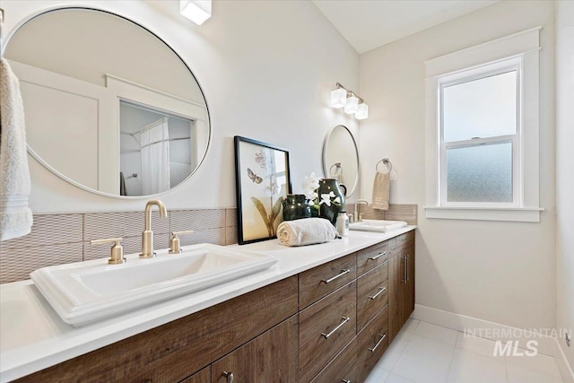 bathroom with tile patterned flooring and vanity