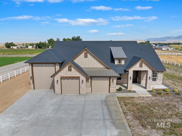 view of front of home featuring a mountain view and a garage