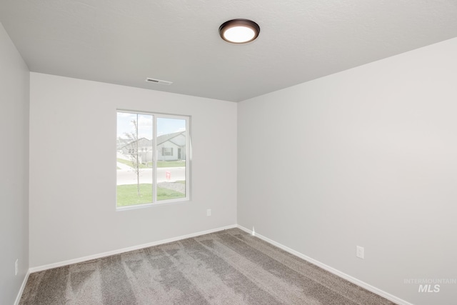 empty room with carpet floors