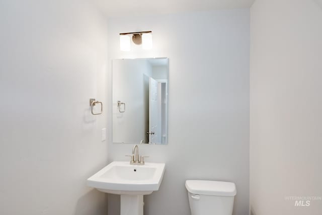 bathroom with toilet and sink