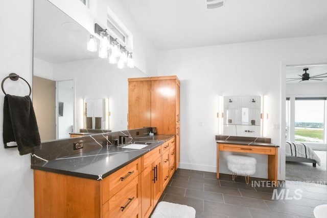 bathroom featuring tile patterned flooring, vanity, and ceiling fan