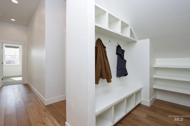 mudroom with recessed lighting, baseboards, and wood-type flooring