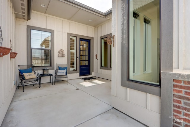 doorway to property featuring brick siding