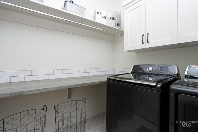 laundry room with cabinet space and washing machine and clothes dryer