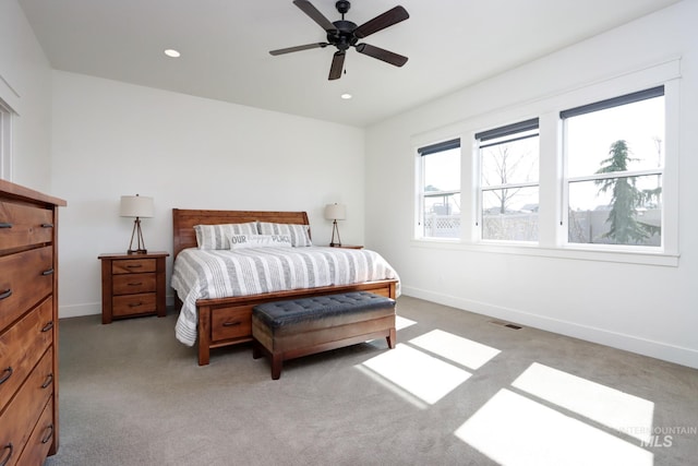 carpeted bedroom with visible vents, recessed lighting, a ceiling fan, and baseboards