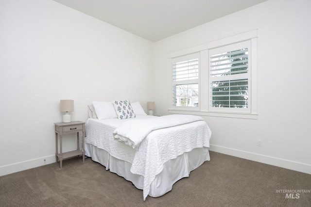 bedroom with baseboards and carpet flooring