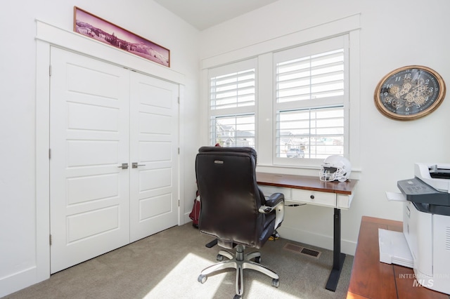 office with carpet, visible vents, and baseboards