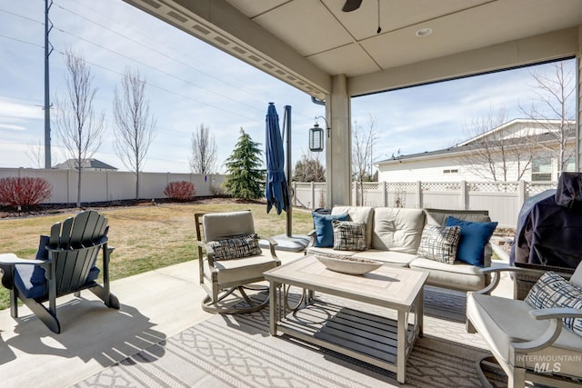 view of patio featuring area for grilling, a fenced backyard, and outdoor lounge area