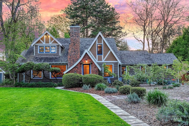 1919 N 21st St, Boise, ID 83702 - english style home featuring a front lawn, a chimney, and a shingled roof