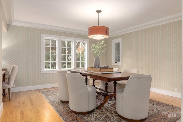 1919 N 21st St, Boise, ID 83702 - dining space with light wood-type flooring, crown molding, baseboards, and wallpapered walls
