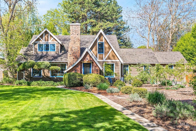 1919 N 21st St, Boise, ID 83702 - tudor house featuring a chimney, a front yard, and roof with shingles
