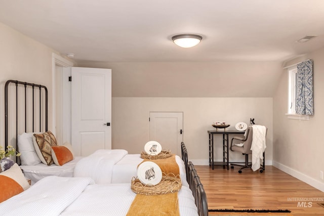 1919 N 21st St, Boise, ID 83702 - bedroom featuring light wood-style floors, baseboards, and vaulted ceiling