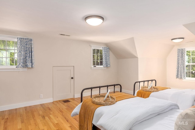 1919 N 21st St, Boise, ID 83702 - bedroom featuring light wood finished floors, baseboards, and vaulted ceiling