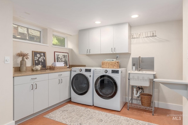 1919 N 21st St, Boise, ID 83702 - washroom with cabinet space, washing machine and clothes dryer, recessed lighting, and baseboards