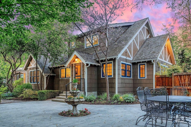 1919 N 21st St, Boise, ID 83702 - back of property at dusk with fence, a patio, and outdoor dining space