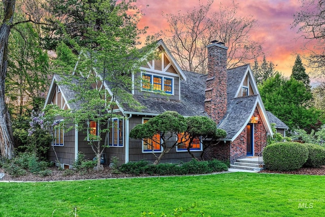 1919 N 21st St, Boise, ID 83702 - view of front of house with a chimney, a front lawn, and a shingled roof