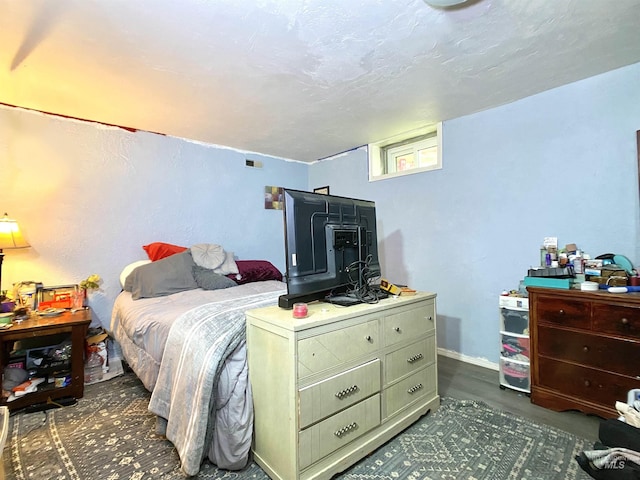 bedroom featuring visible vents and baseboards