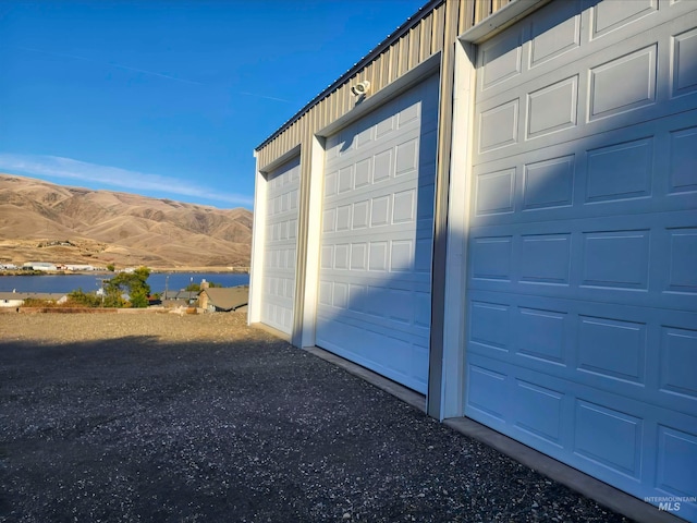 garage with a water and mountain view