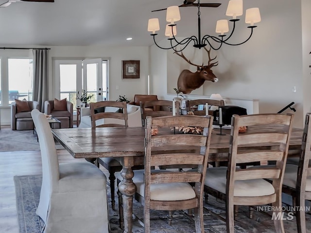 dining area with an inviting chandelier