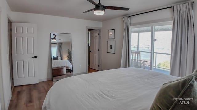 bedroom with access to exterior, ceiling fan, and dark hardwood / wood-style flooring