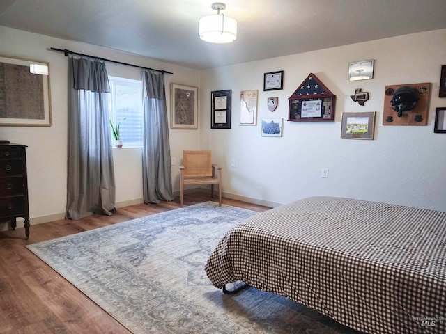 bedroom with hardwood / wood-style floors